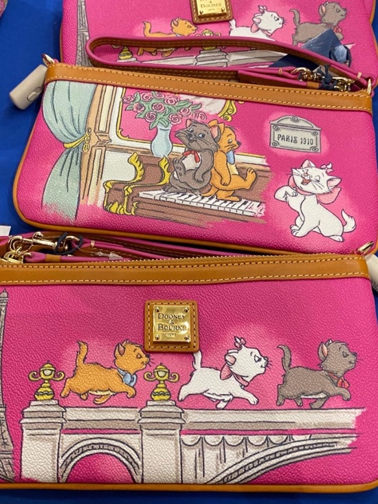 Dooney & Bourke Handbags - ❗️ISO❗️aristocats Dooney and Burke wristlet ❗️ISO❗️